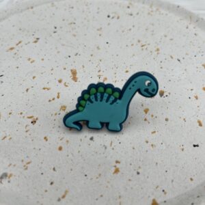 Bijou en silicone pour chaussure dinosaure turquoise
