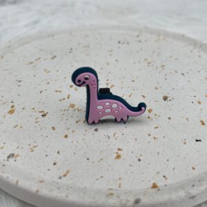 Bijou en silicone pour chaussure dinosaure rose