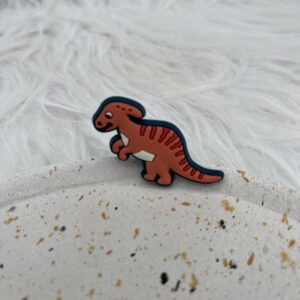 Bijou en silicone pour chaussure dinosaure terracotta