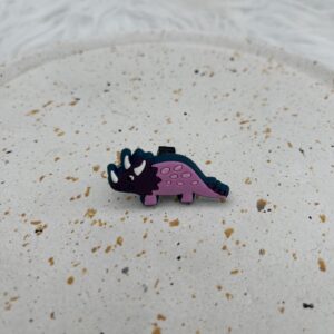 Bijou en silicone pour chaussure dinosaure mauve et rose