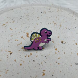Bijou en silicone pour chaussure dinosaure mauve et jaune