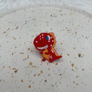 Bijou en silicone pour chaussure dinosaure rouge