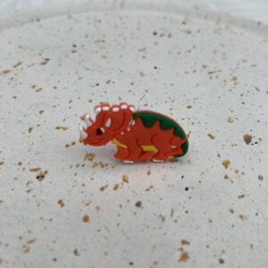 Bijou en silicone pour chaussure dinosaure orange