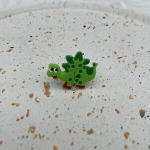 Bijou en silicone pour chaussure dinosaure vert
