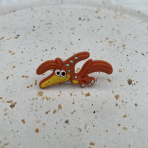 Bijou en silicone pour chaussure dinosaure orange volant