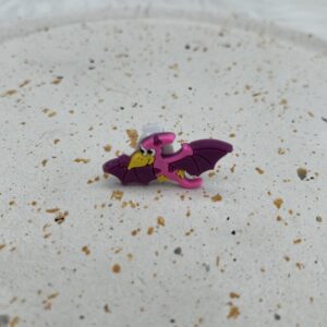 Bijou en silicone pour chaussure dinosaure volant rose